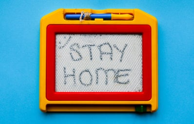 \"Stay home\" written on an etch-a-sketch
