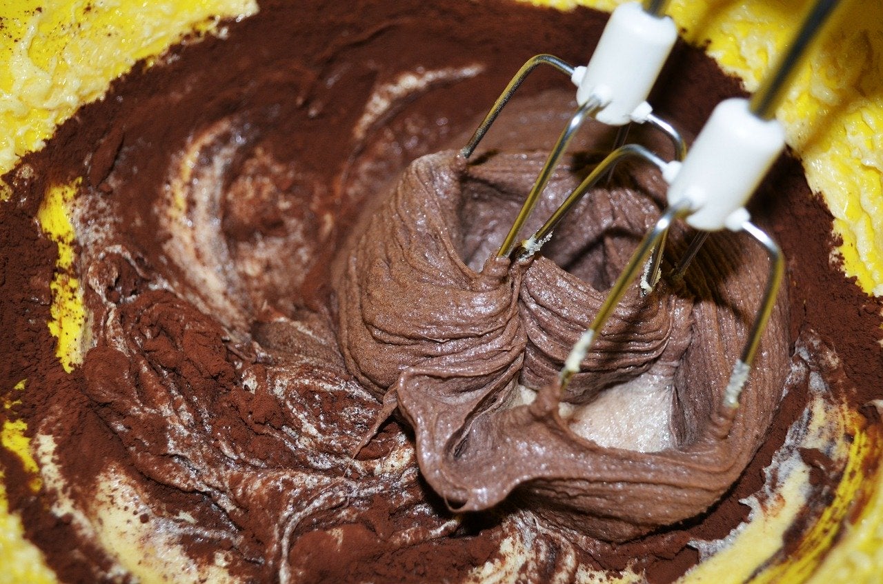 a hand mixer in brownie batter