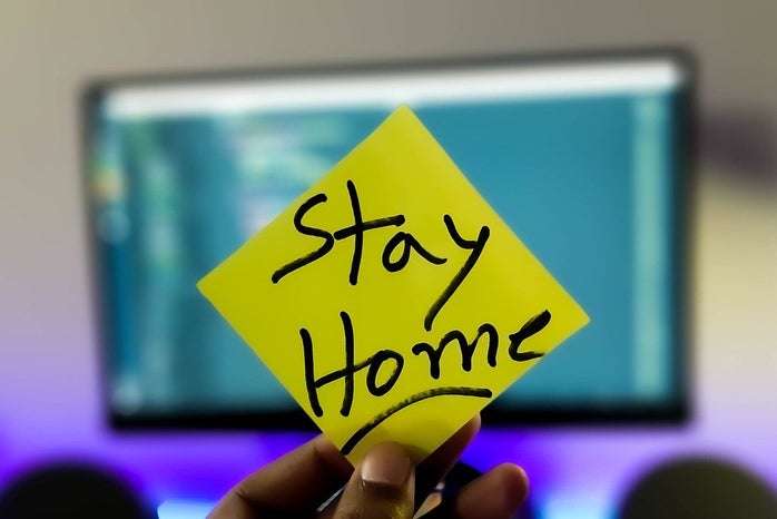 sticky note that has \"Stay home\" written on it