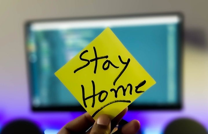 sticky note that has \"Stay home\" written on it