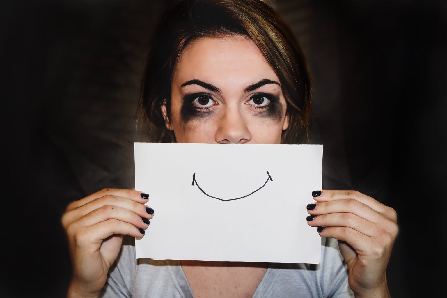 person holding white printer paper, mental health
