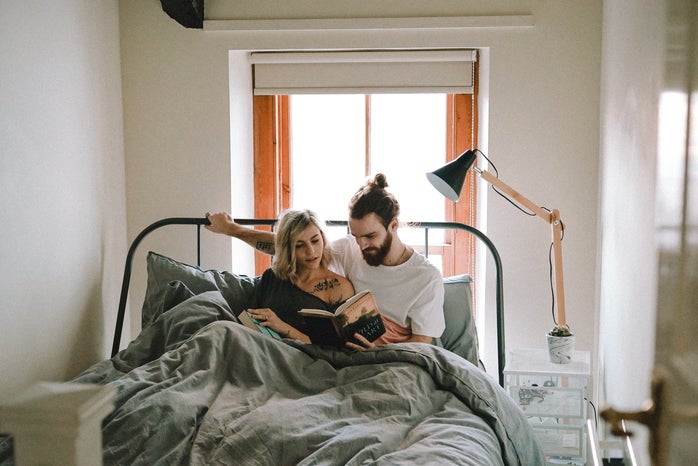 man and woman reading in bed?width=698&height=466&fit=crop&auto=webp