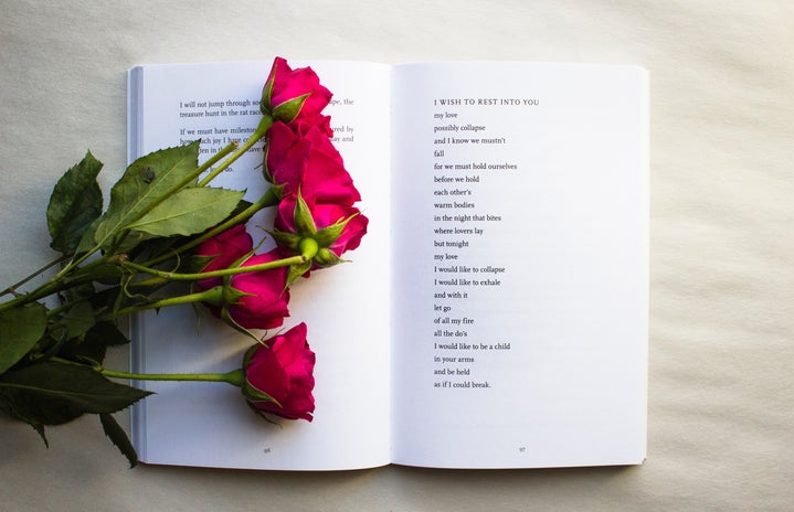 red roses on a book of poetry