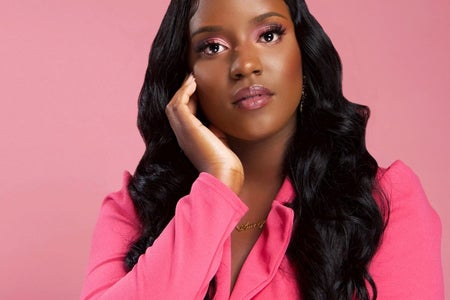 a black girl in all pink with a pink background