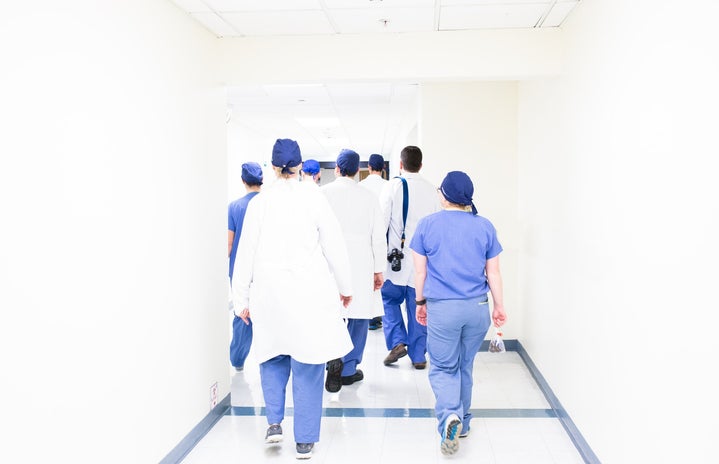 A group of doctors walking down a hallway