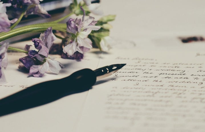 letter with flowers and pen