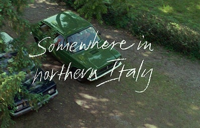 scene from \"Call Me By Your Name\", car with words \"Somewhere in Northern Italy\"