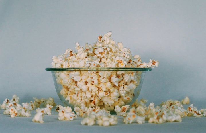 A glass bowl of popcorn