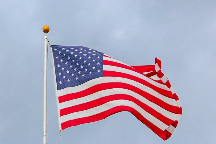 usa flag waving on white metal pole 1550342?width=698&height=466&fit=crop&auto=webp