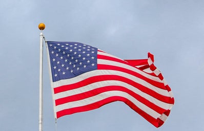 usa flag waving on white metal pole 1550342?width=398&height=256&fit=crop&auto=webp