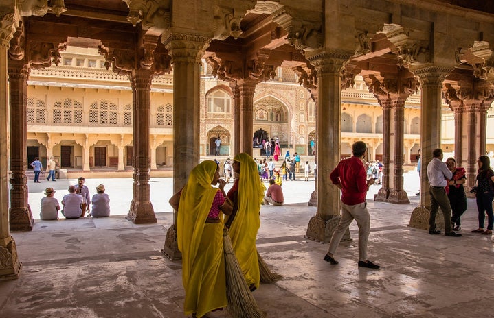 People walking through a building in India
