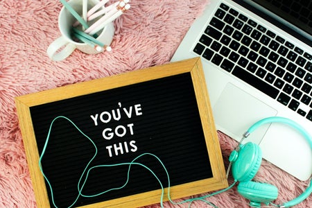 Mac laptop with a You Got This sign