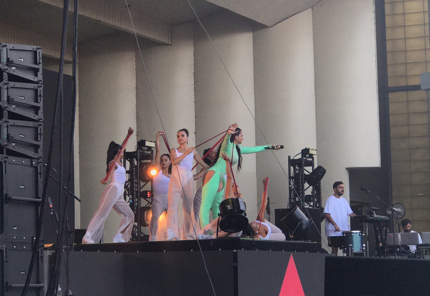 Spanish-singer Rosalia on stage with her dance crew