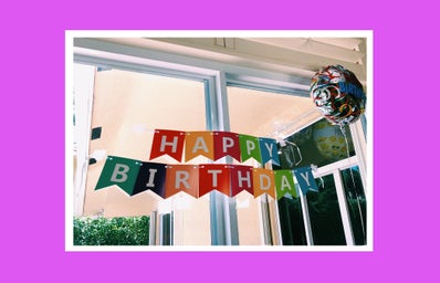 Birthday banner inside home with pink background
