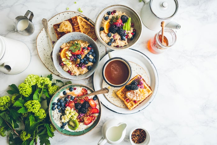 brunch spread with breakfast, coffee, and flowers