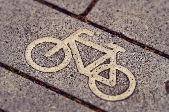 a bike drawn on a sidewalk