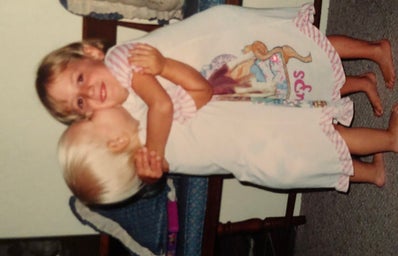 my cousin & i hugging as children