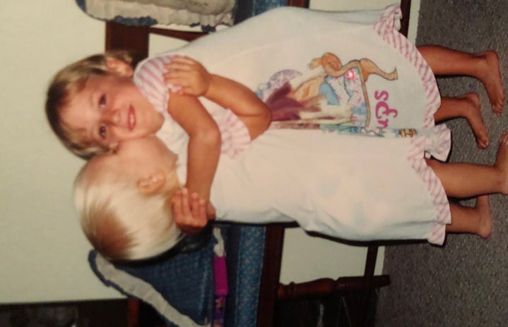 my cousin & i hugging as children