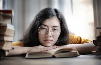 Academics 6 2020 pexels tired female student lying on book in library 3808080?width=398&height=256&fit=crop&auto=webp