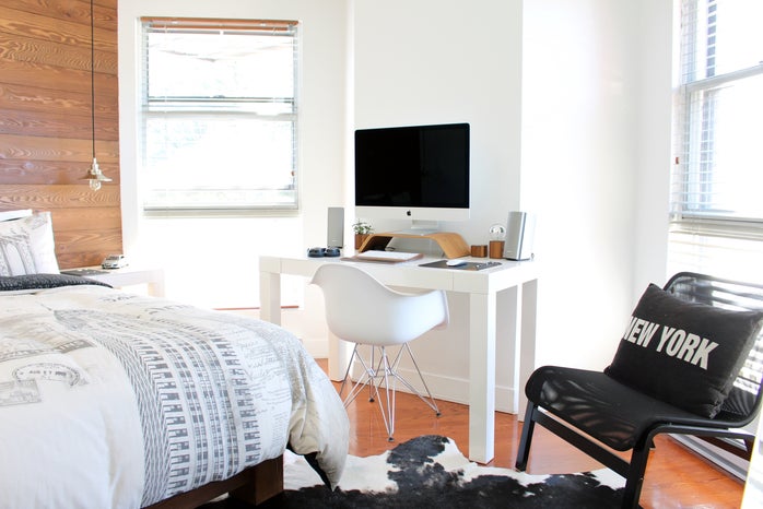 bright white bedroom with desk working space