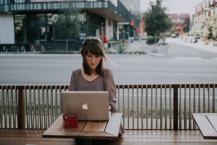 Woman working outside on Laptop by Christin Hume for Unsplash?width=698&height=466&fit=crop&auto=webp