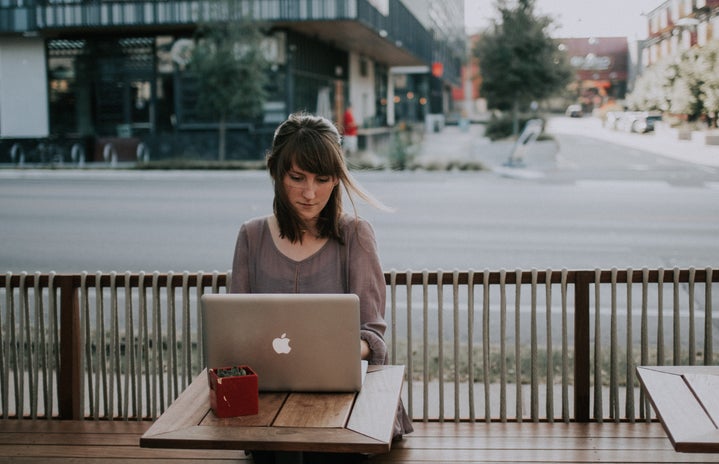 woman outside with laptop
