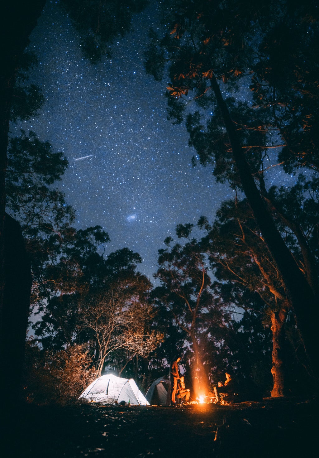 Bonfire and tent under the stars