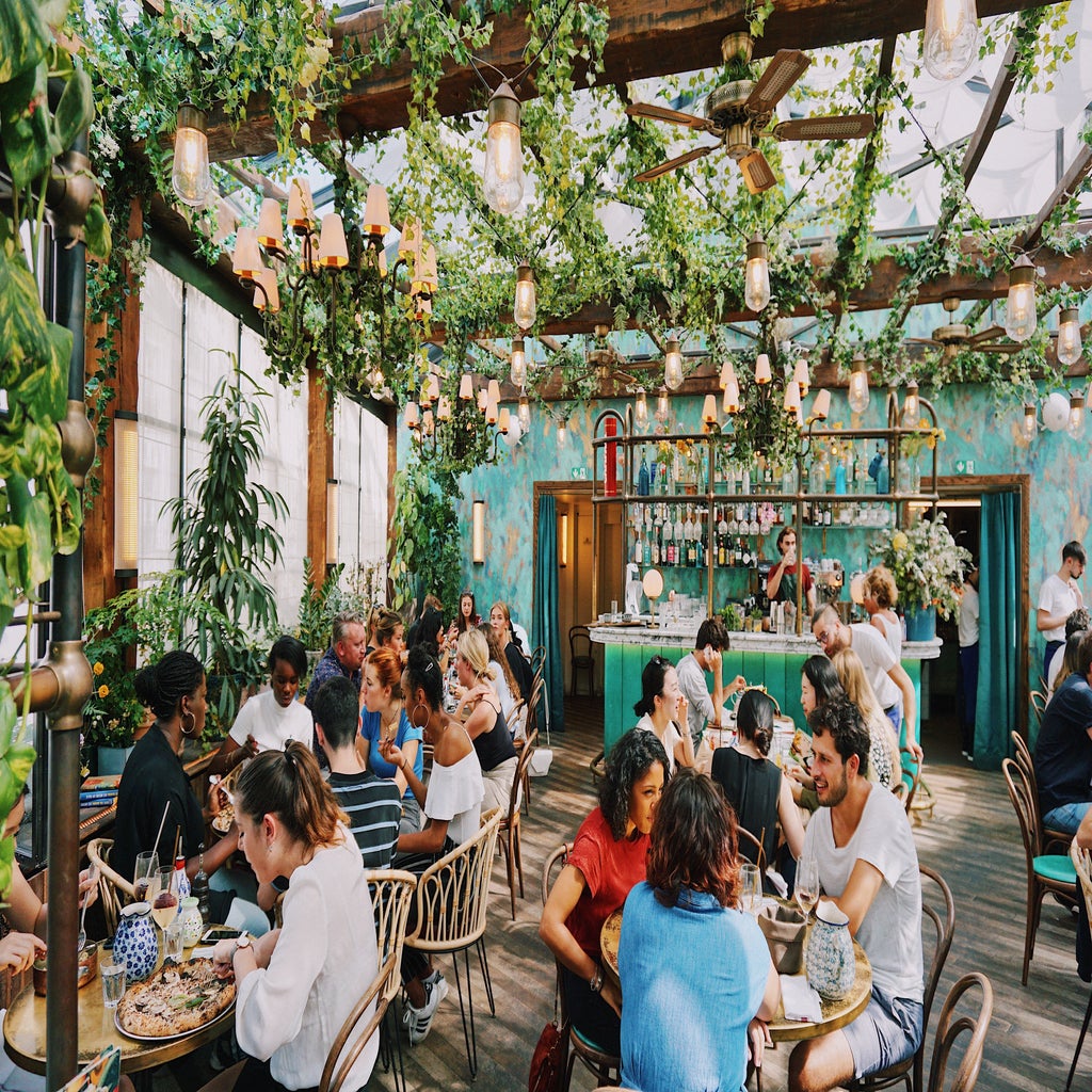 restuarant with greenery and lights