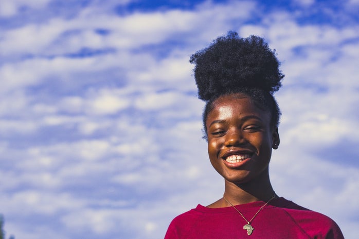 Person smiling outside by Unsplash?width=698&height=466&fit=crop&auto=webp