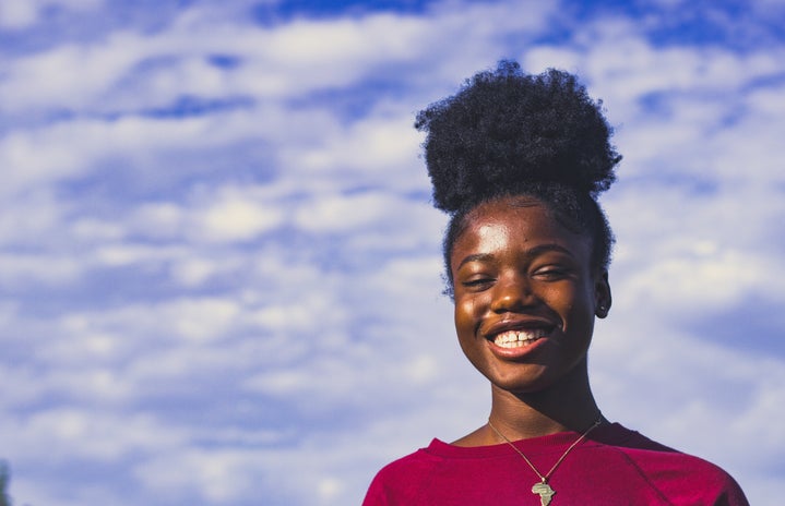 Person smiling outside by Unsplash?width=719&height=464&fit=crop&auto=webp
