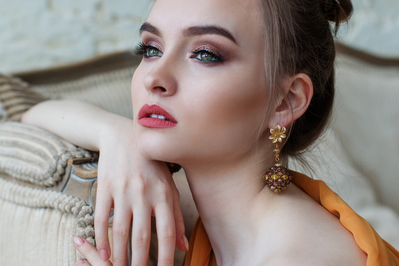 Woman in makeup looking into distance, pretty eyes