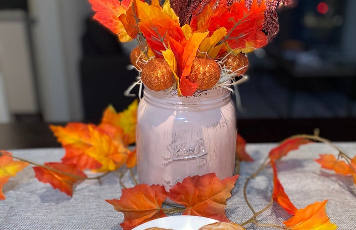 completed fall centerpiece with two pumpkin spice scones in front