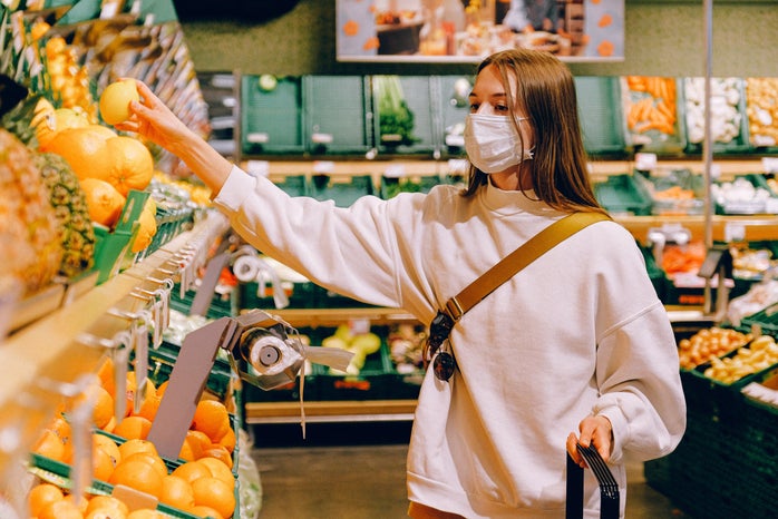 woman wearing mask grocery shopping