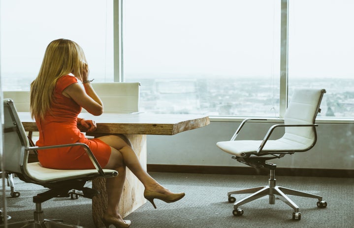 Working business woman in dress at office