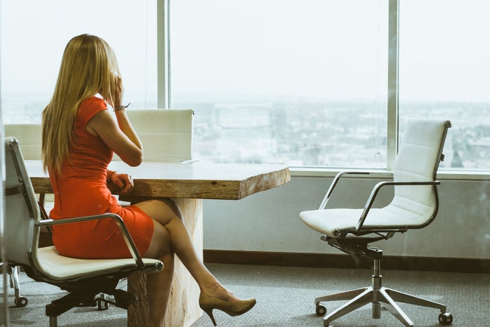 Working business woman in dress at office
