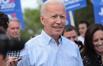 Joe Biden smiling at outdoor event