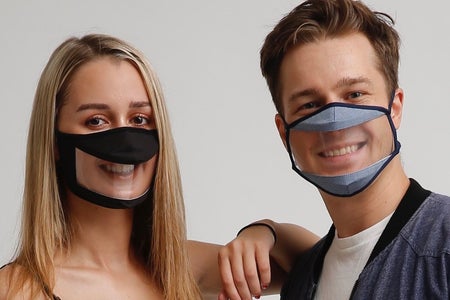Boy and girl with smile mask
