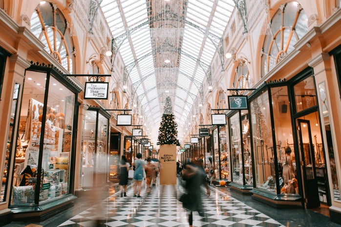 people walking past shops in a mall
