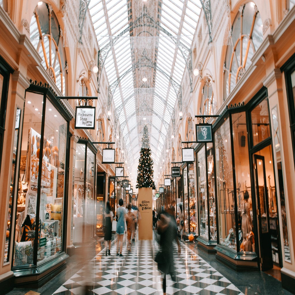 people walking past shops in a mall