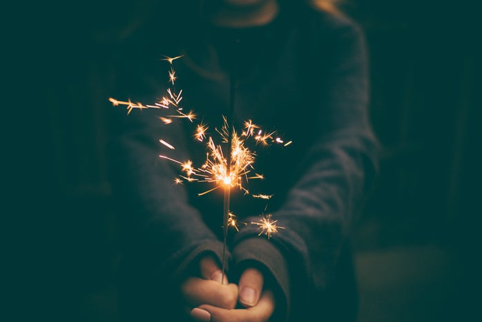 person holding sparkler
