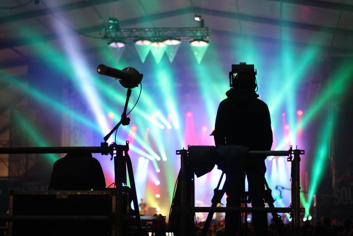 silhouette of man standing on stage