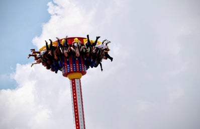 people riding on amusement park