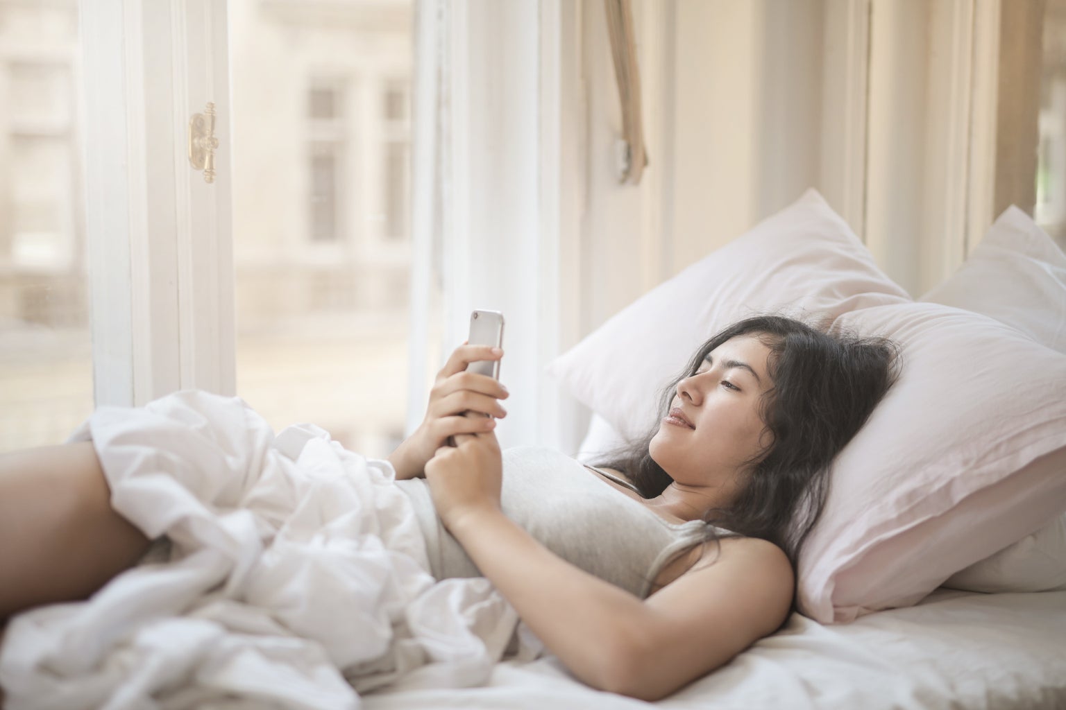 young woman using smartphone in bed 3807633?width=1024&height=1024&fit=cover&auto=webp