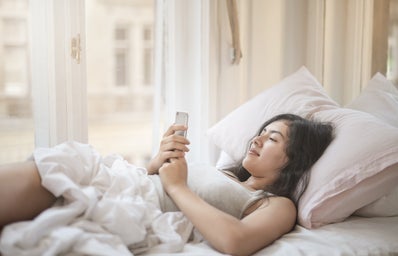 young woman using smartphone in bed 3807633?width=398&height=256&fit=crop&auto=webp