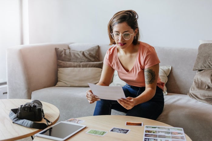 Woman studying photos