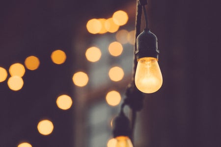 low depth of field photo of string of lightbulbs