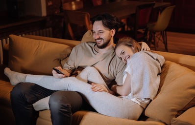 couple cuddling on the couch watching movie?width=398&height=256&fit=crop&auto=webp