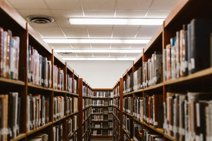 aisle between bookshelves in library