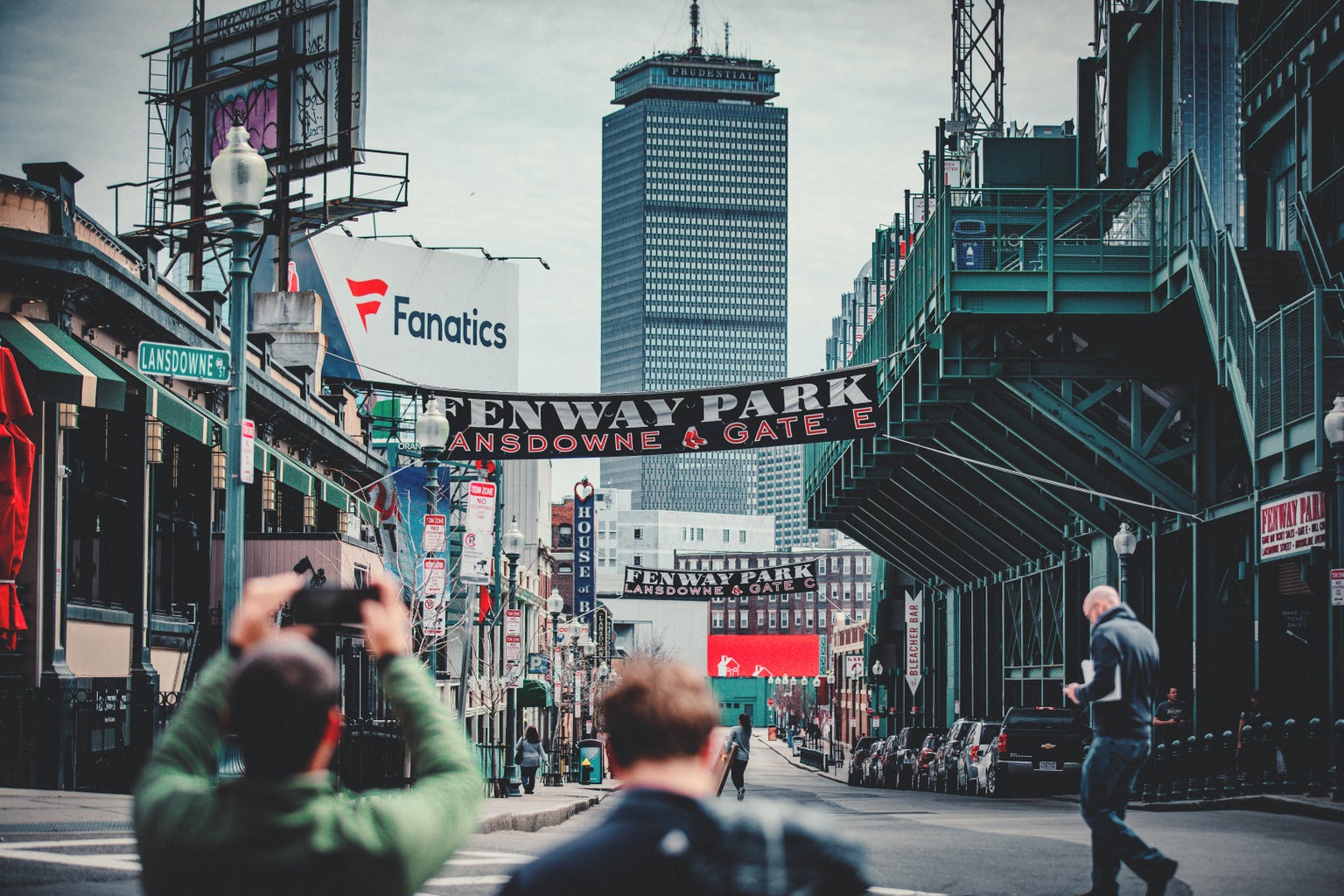 woman taking photo using DSLR camera of Landsdowne Street near Fenway Park