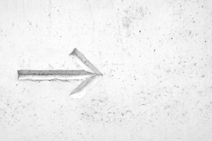 right arrow sign on wall